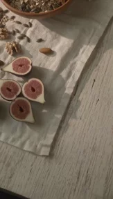 Orange juice poured beside a bowl of granola, created with VideoGen